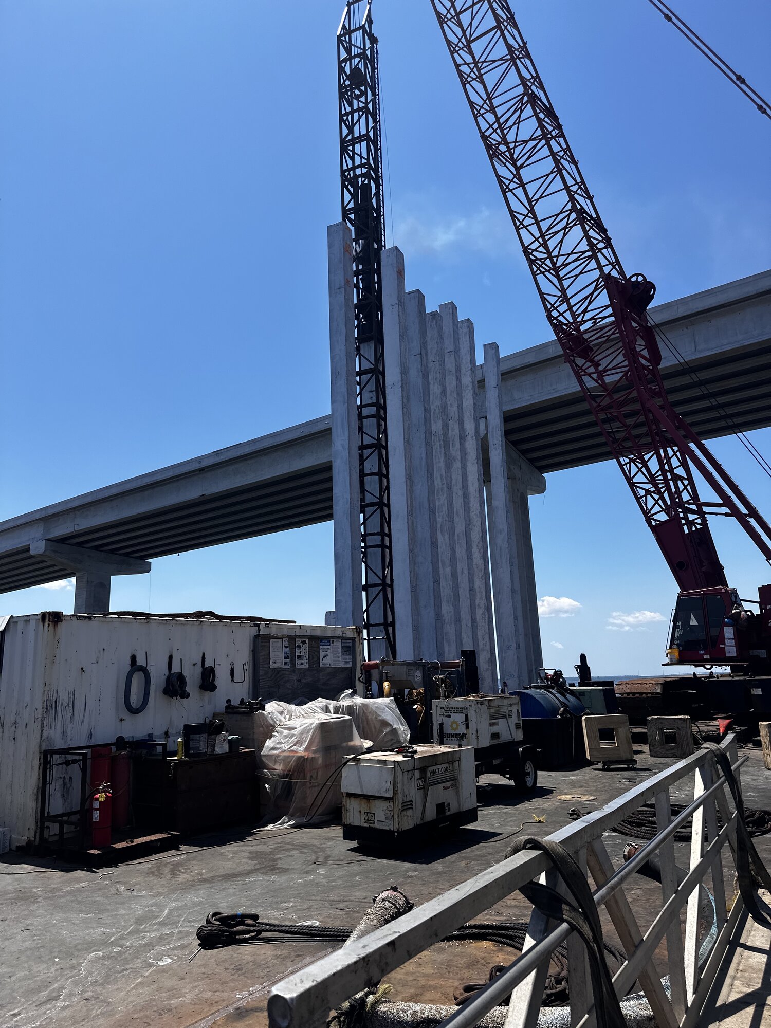 Pile driving crane at bridge construction site