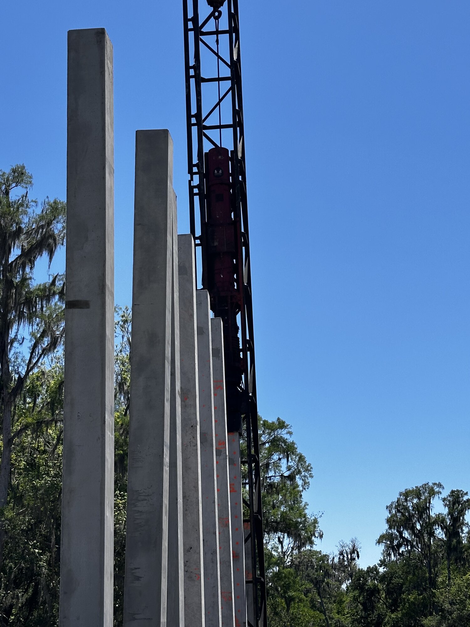 Concrete piles staged on barge
