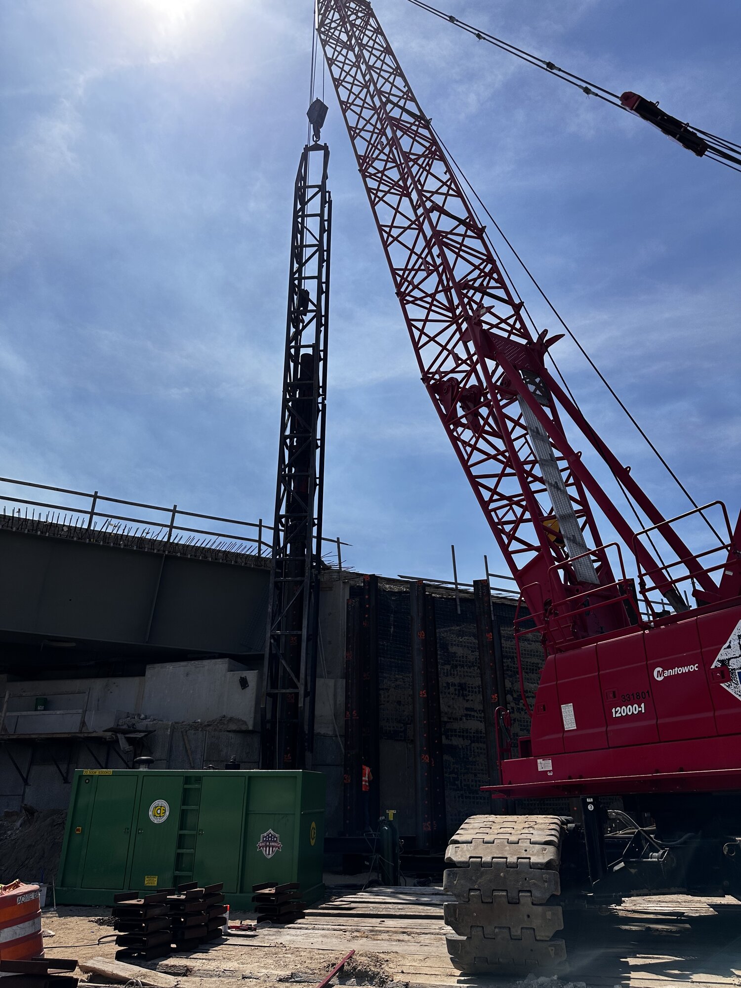 Crane driving piles at bridge jobsite