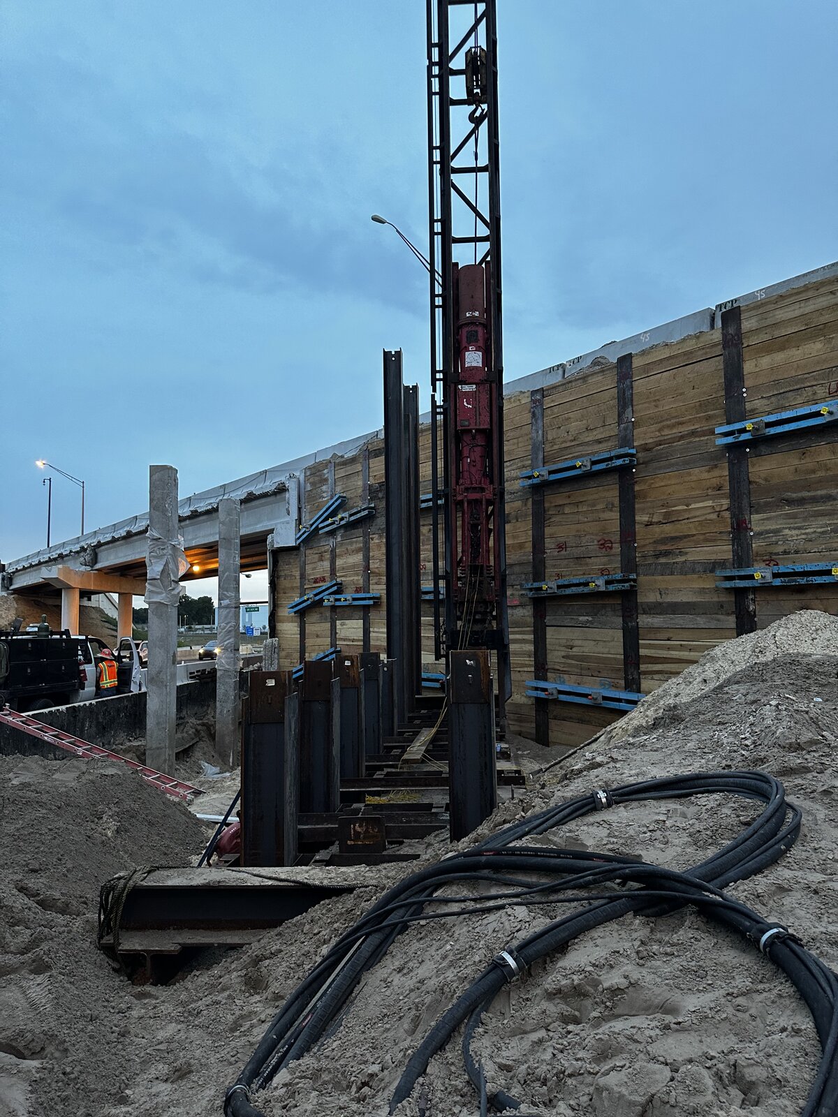 Sheet pile wall installation at dusk