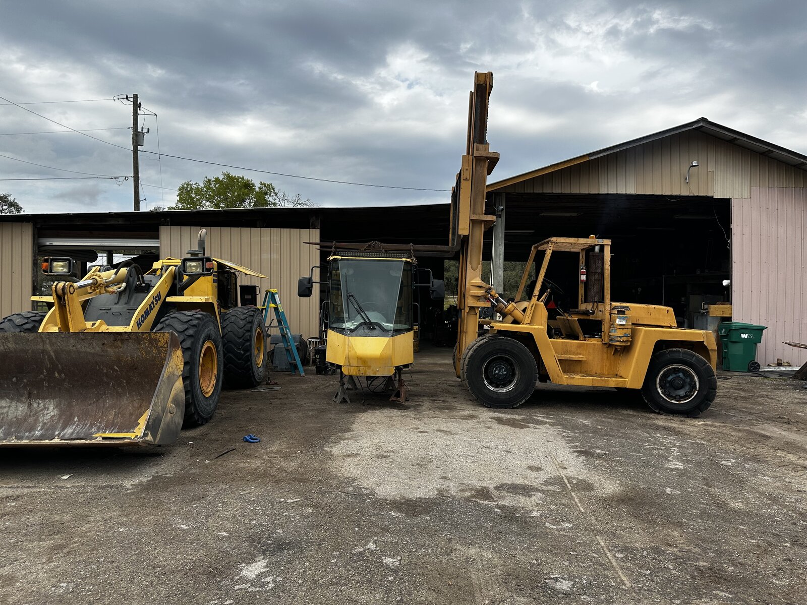 Equipment yard in front of R&R shop building
